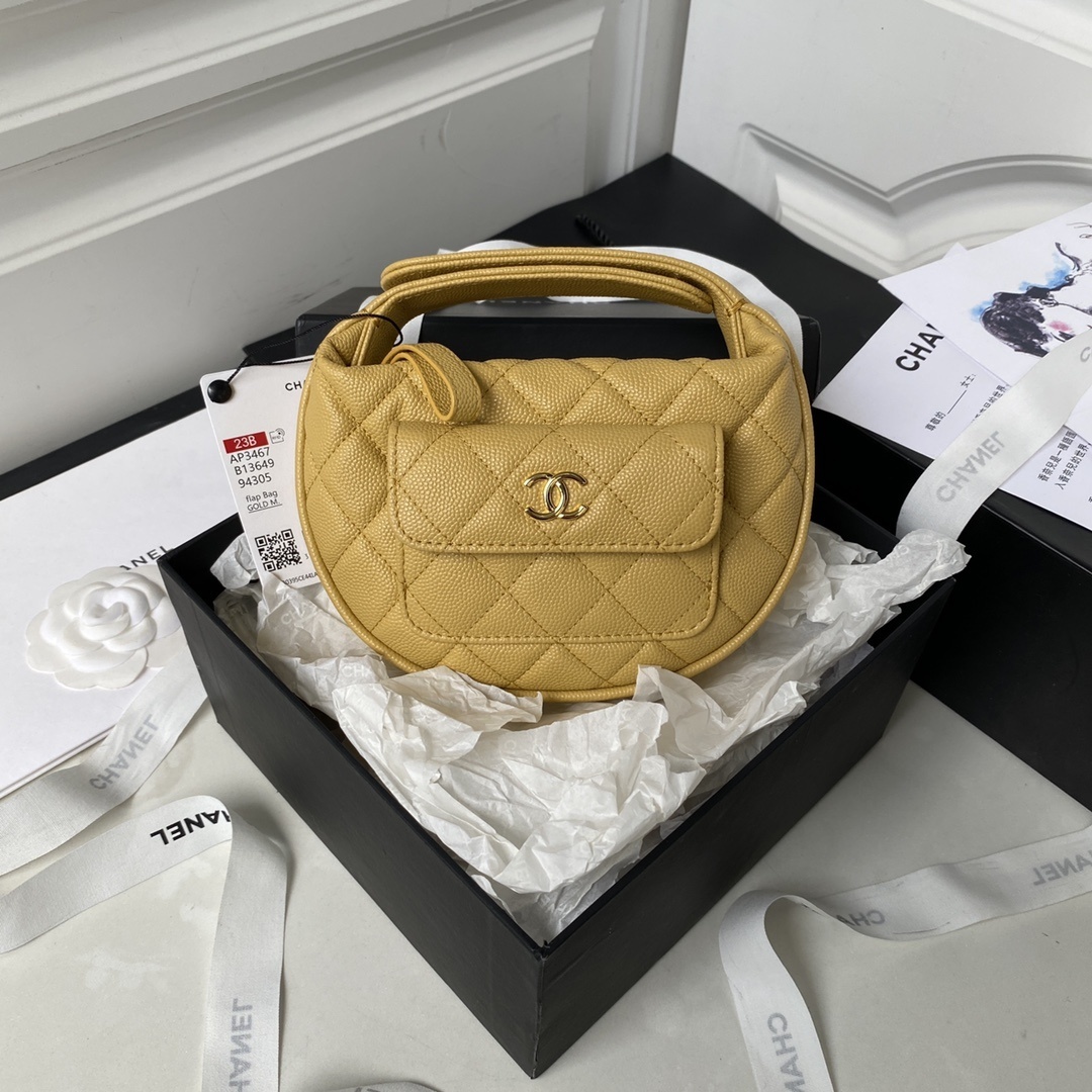 Chanel small yellow, diamond-quilted Hula Hoop Bag in lambskin leather.