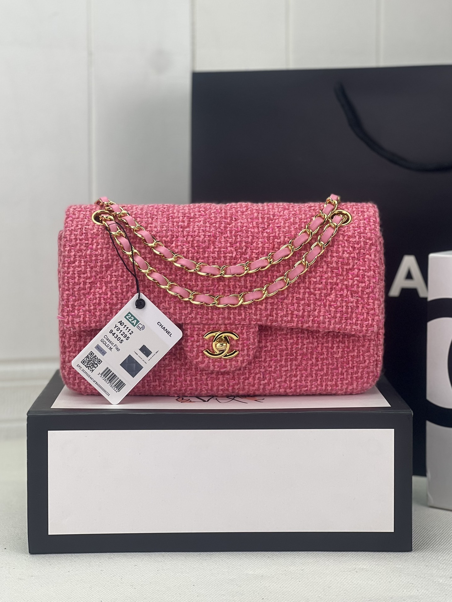 Chanel Mini Classic Flap Bag in pink tweed with gold-tone hardware