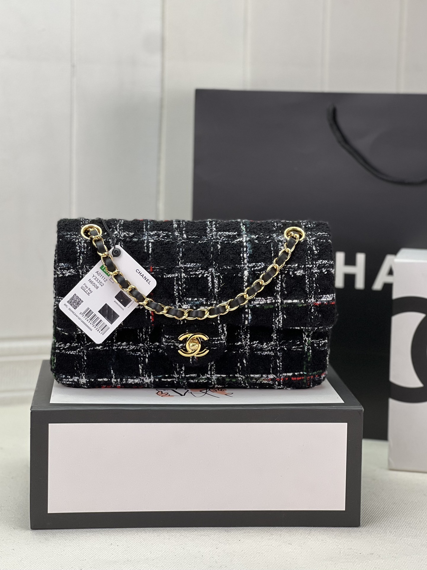 Chanel Classic Flap bag in black and white tweed with gold-tone hardware