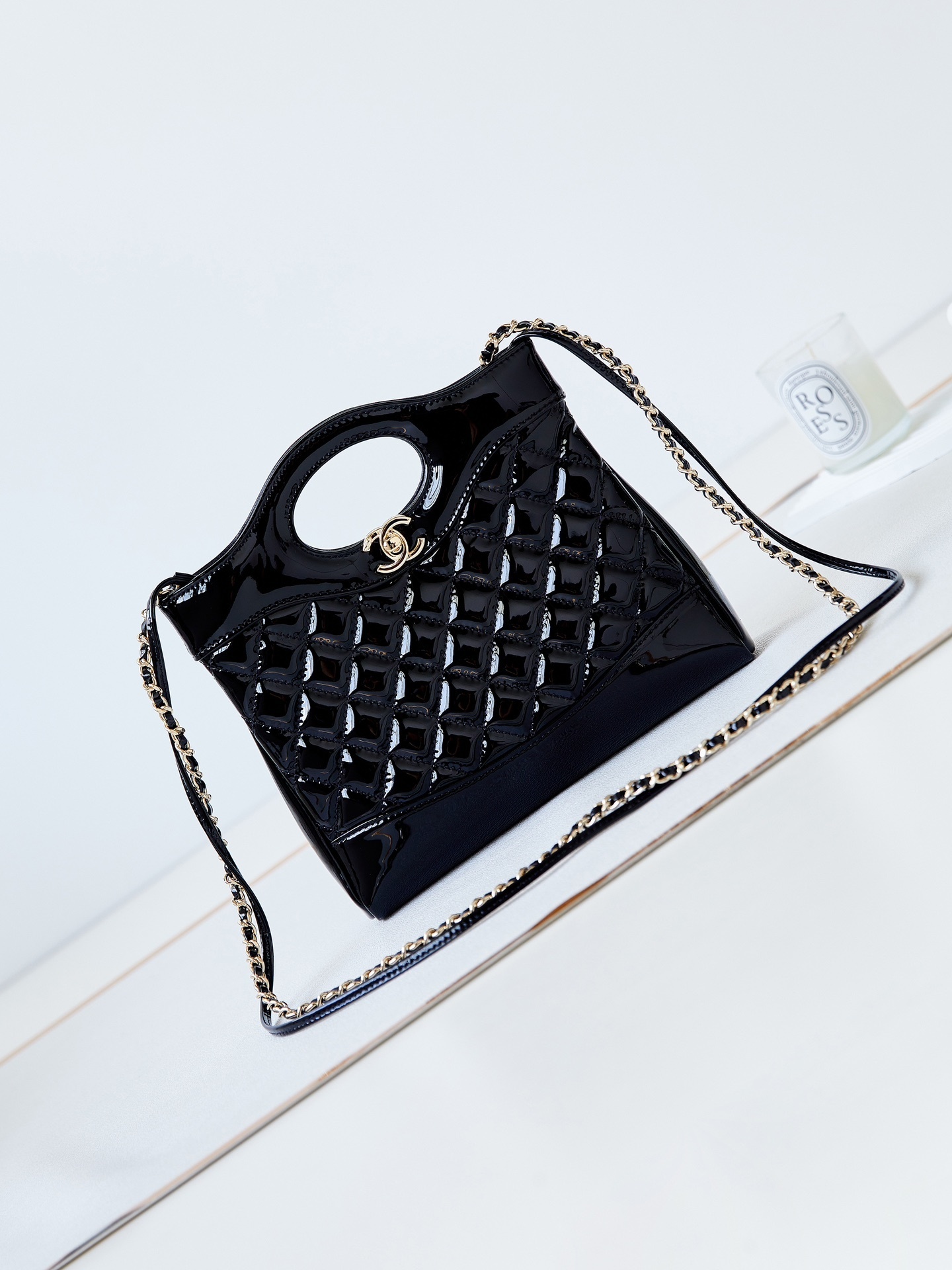 Chanel 31 Mini Shopping bag in black shiny lambskin with gold-tone hardware