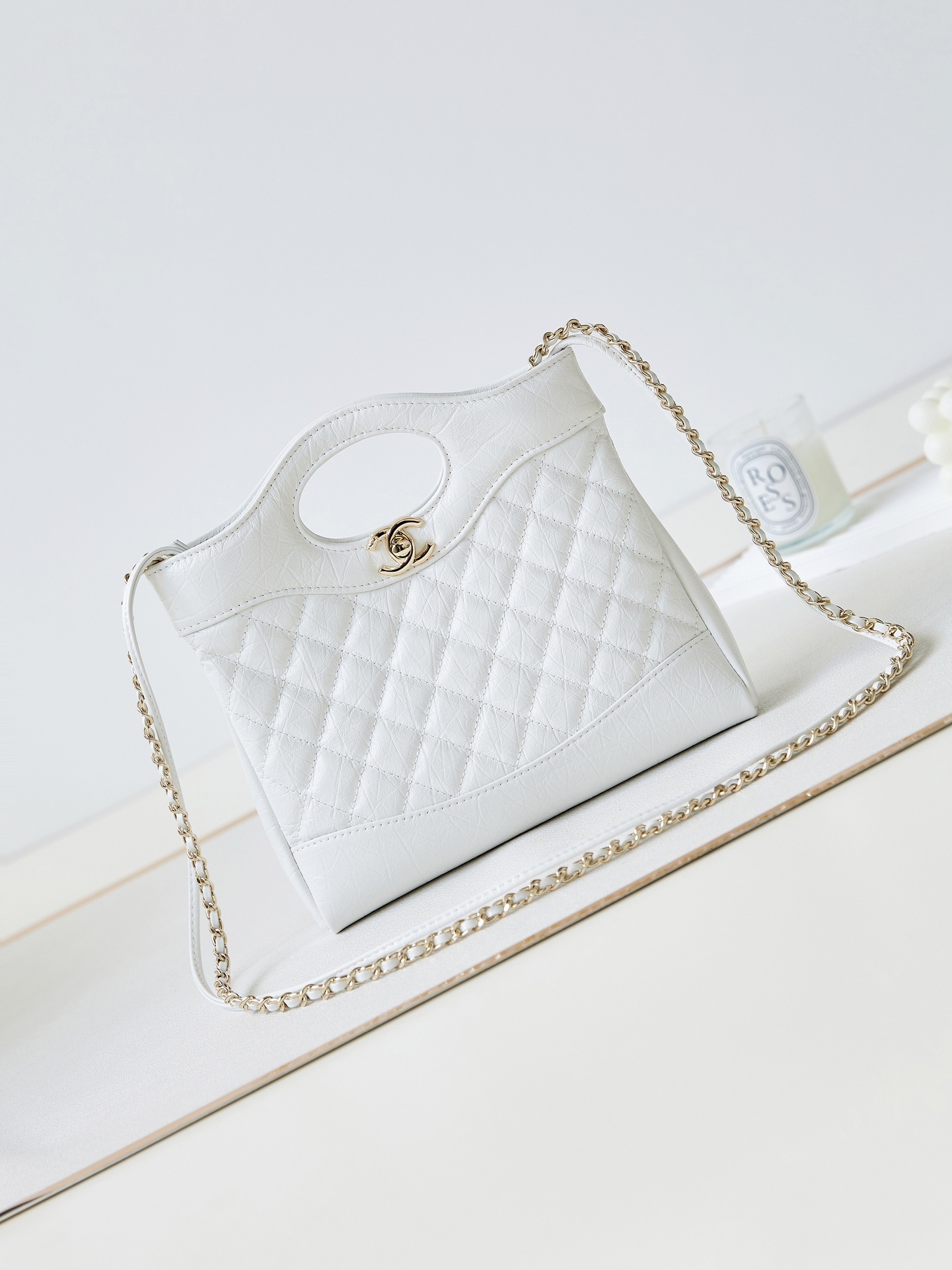 Chanel Mini 31 Shopping Bag in white quilted lambskin leather with gold-tone hardware