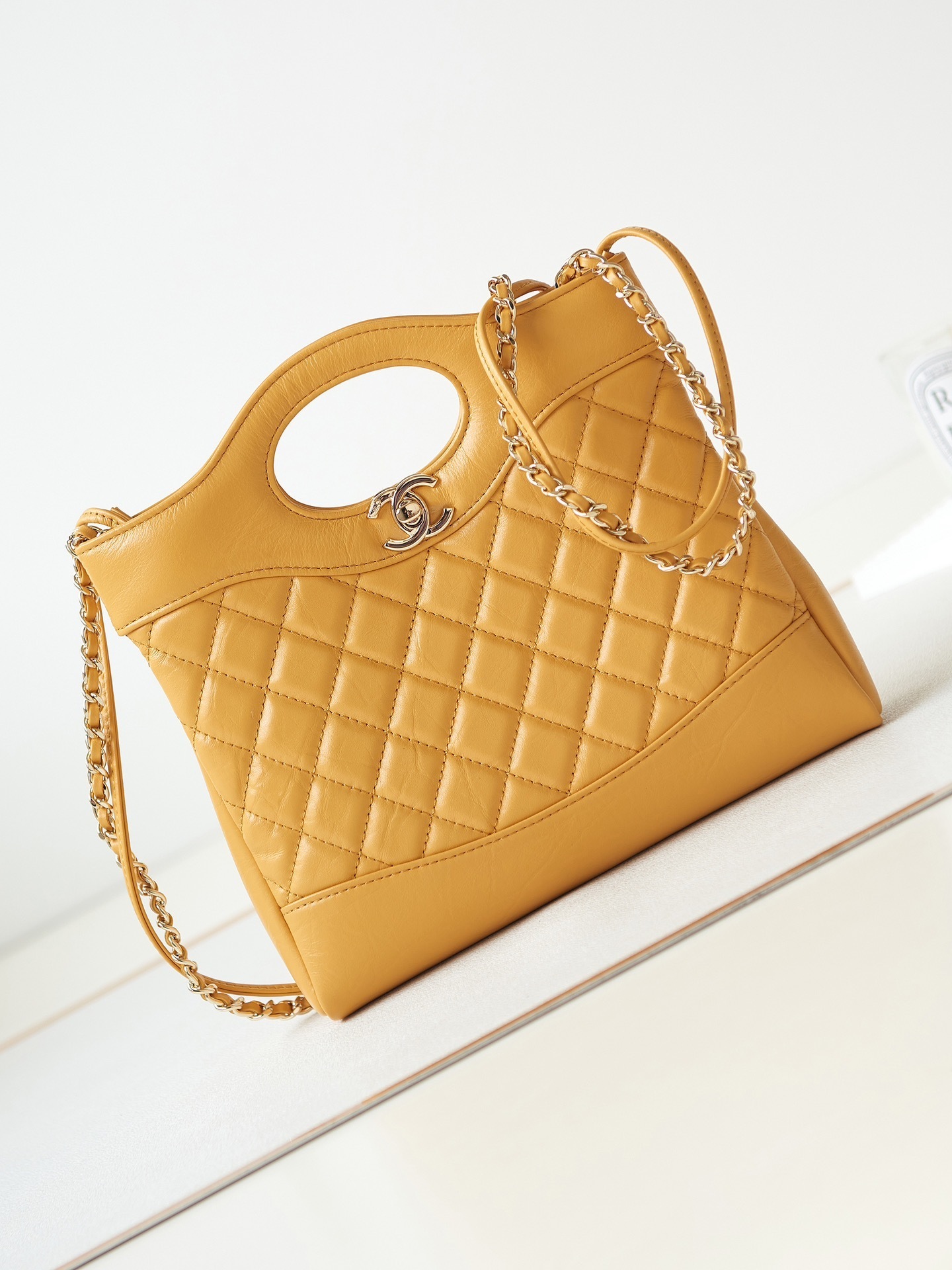Chanel 31 Line AS4133 handbag in yellow calfskin leather with gold-tone hardware