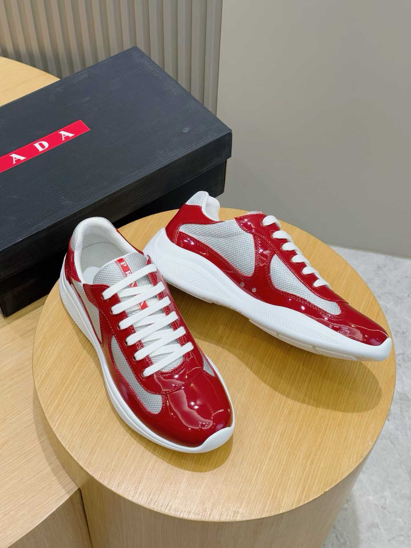 Prada America's Cup low-top sneakers in red patent leather and grey mesh