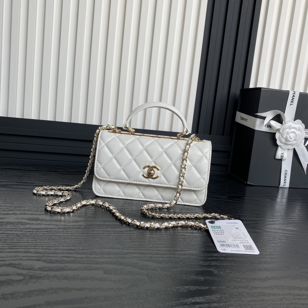 Chanel white quilted leather Chanel top handle bag with a gold-tone CC logo and chain strap