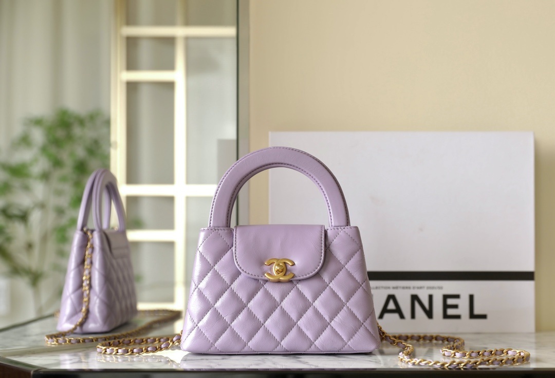 Chanel Shiny Aged Calfskin Quilted Nano Kelly Shopper bag in lilac/light purple with aged gold hardware.