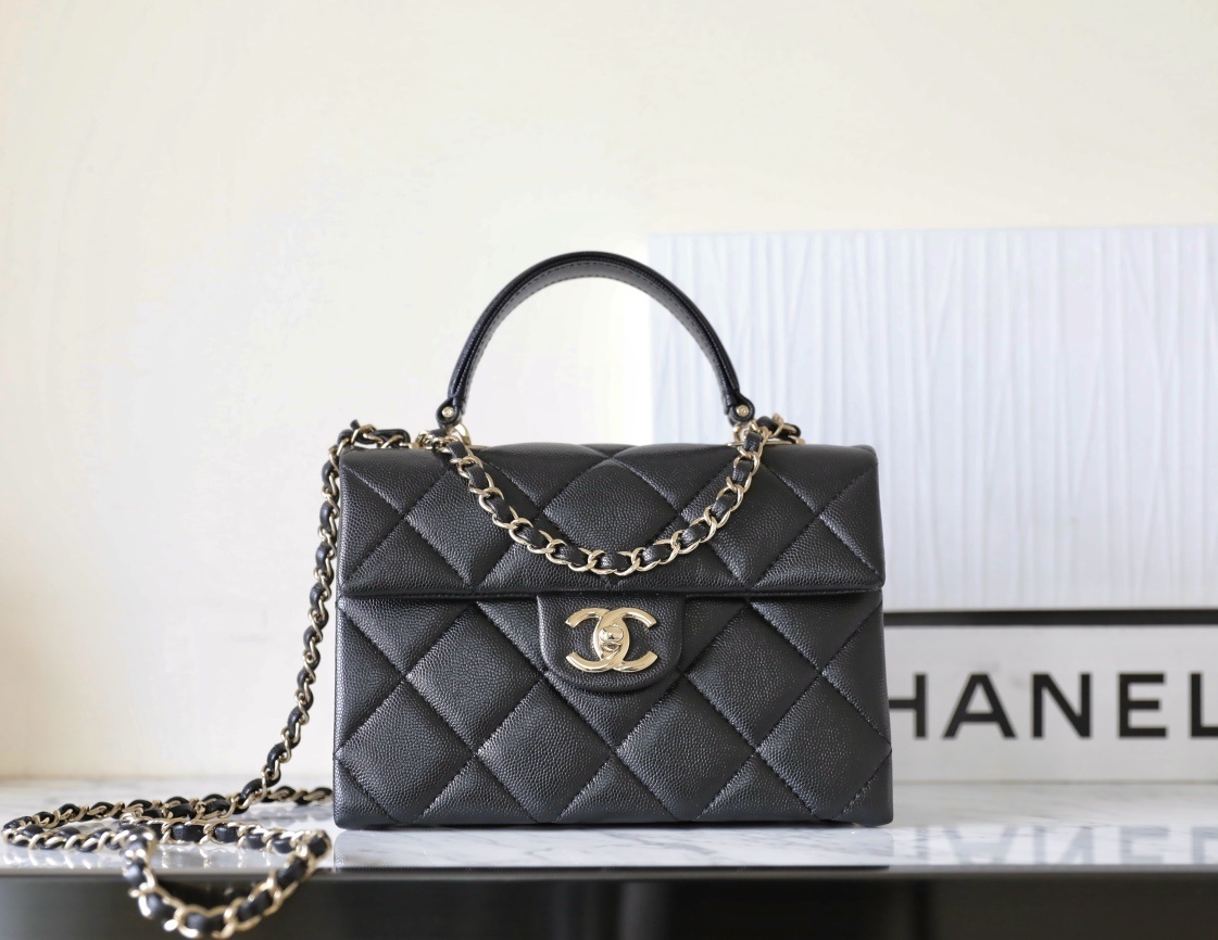 Chanel small square top handle flap bag in black quilted caviar leather with light gold hardware