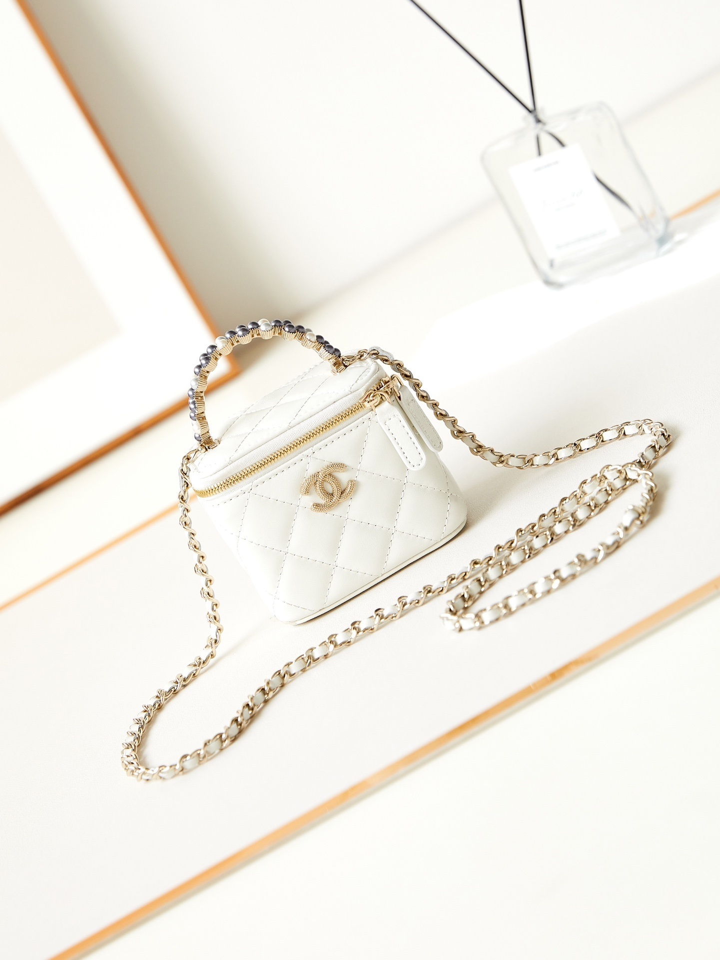 Chanel white quilted Chanel Vanity Case with a chain and top handle