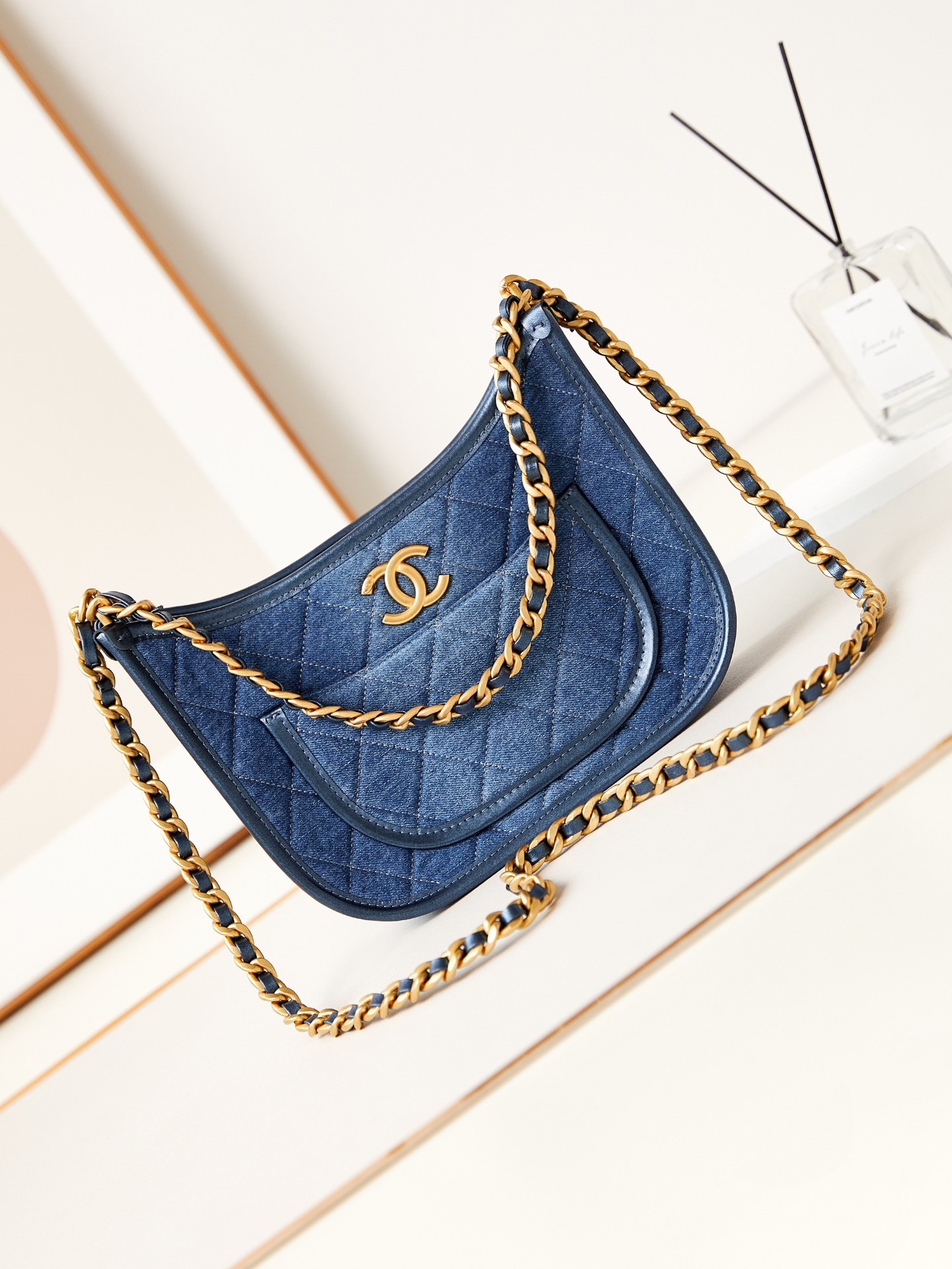 Chanel hobo bag in blue denim with gold-tone metal accents