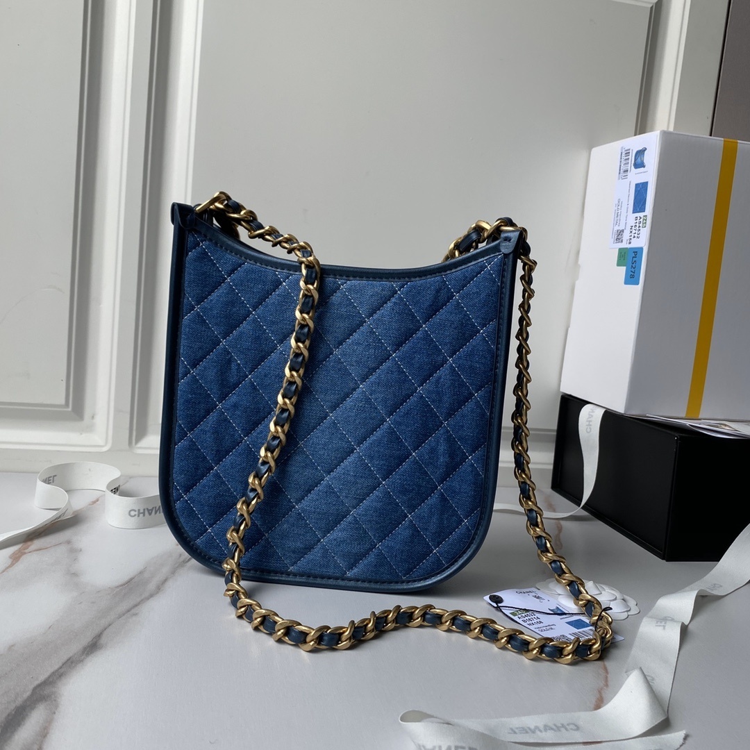 Chanel Washed Denim Hobo Bag in blue with a gold-tone metal chain strap