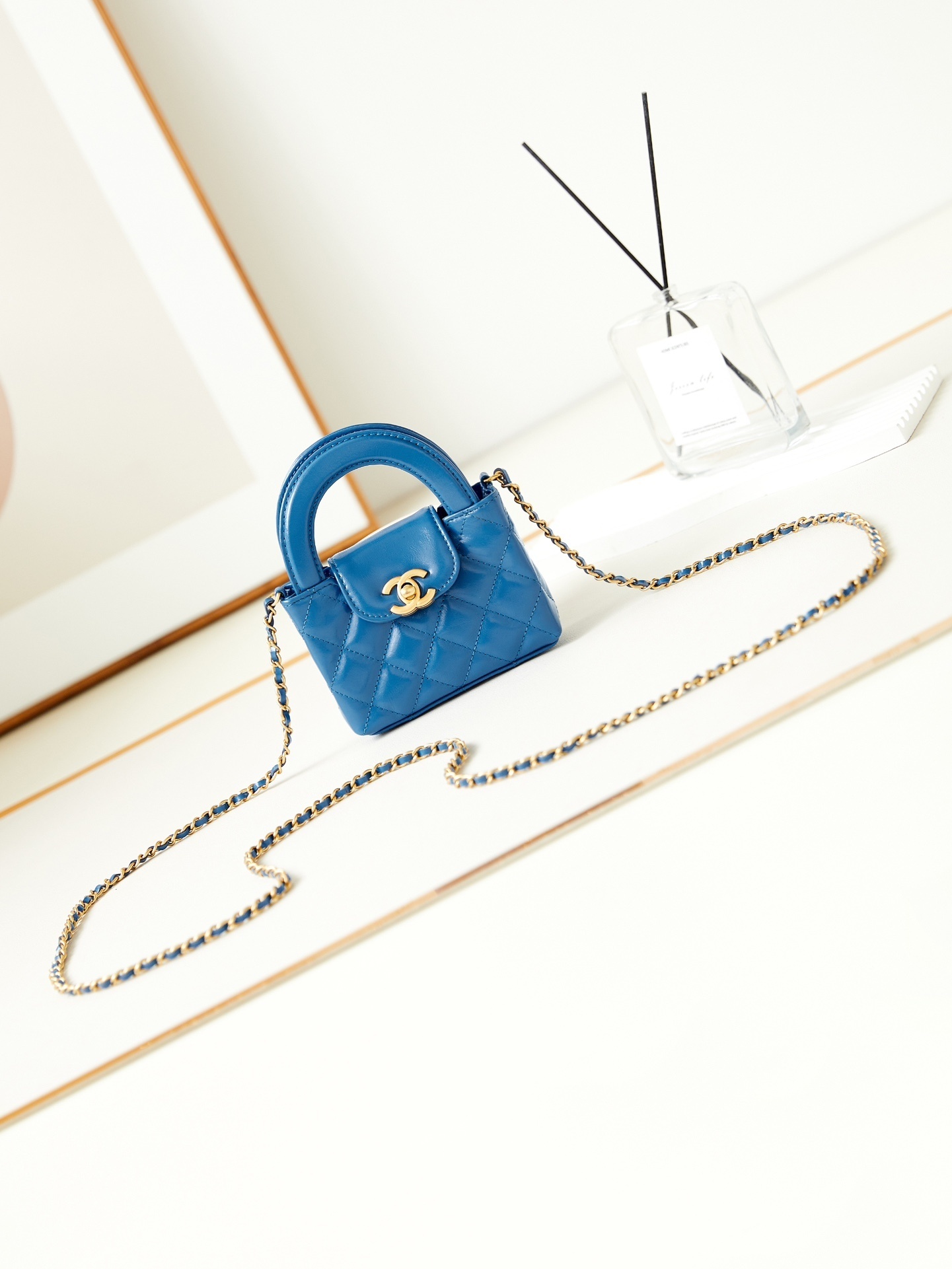 Chanel Mini Shopping Bag in a blue hue with gold-tone hardware