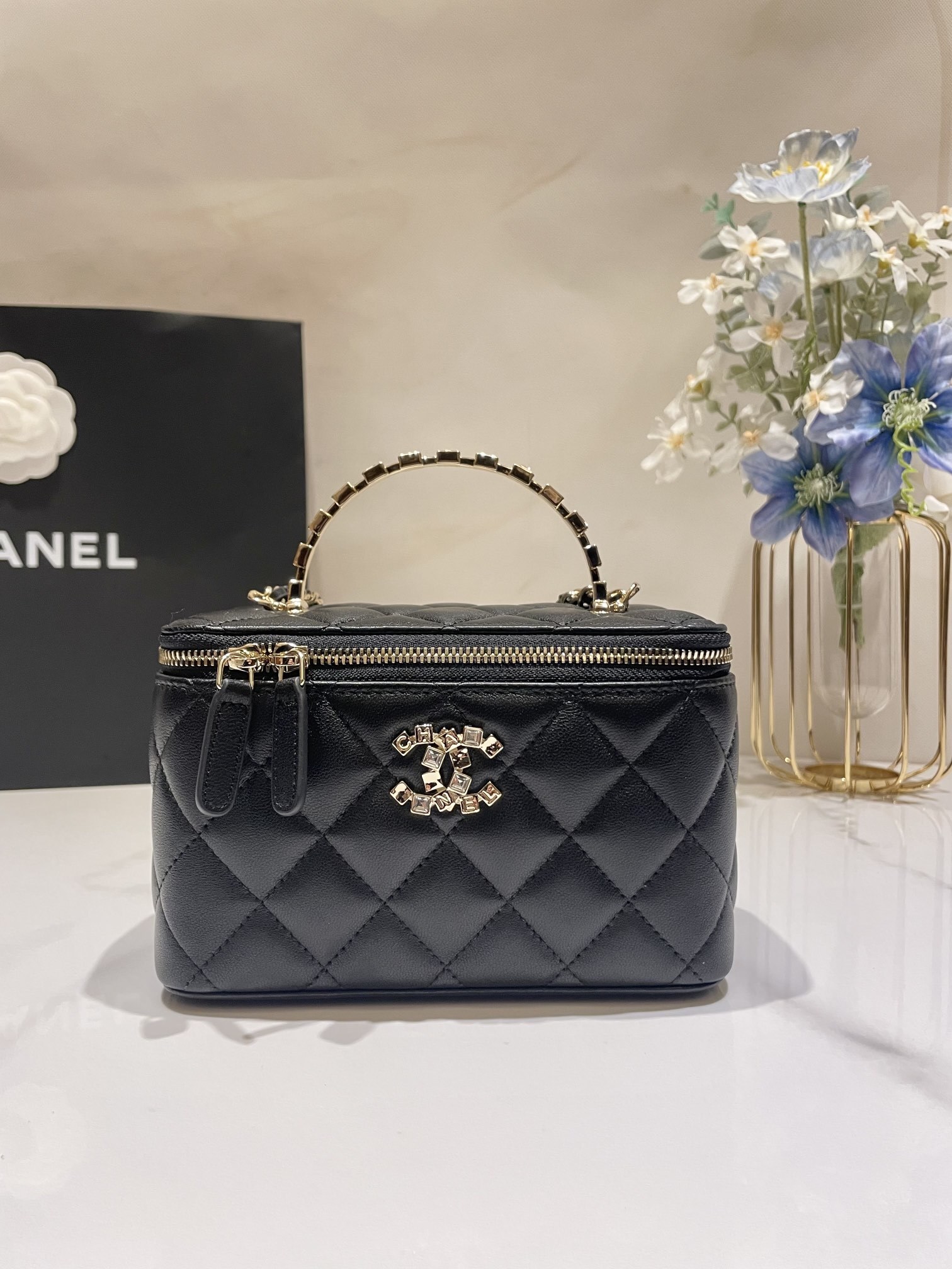 Chanel Small Top Handle Vanity Case in black lambskin leather with light gold-tone hardware