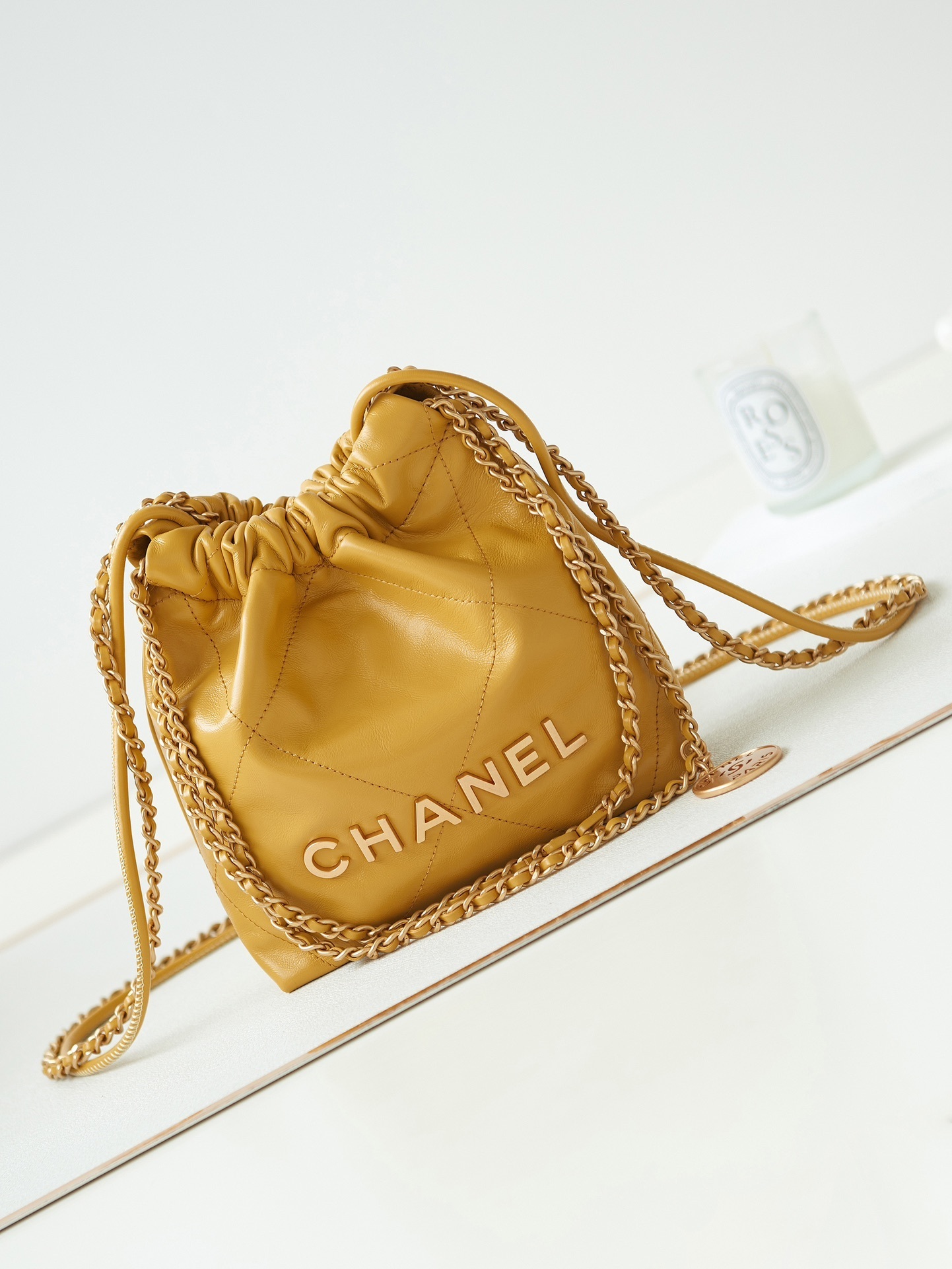 Chanel 22 mini handbag in shiny calfskin and gold-tone metal