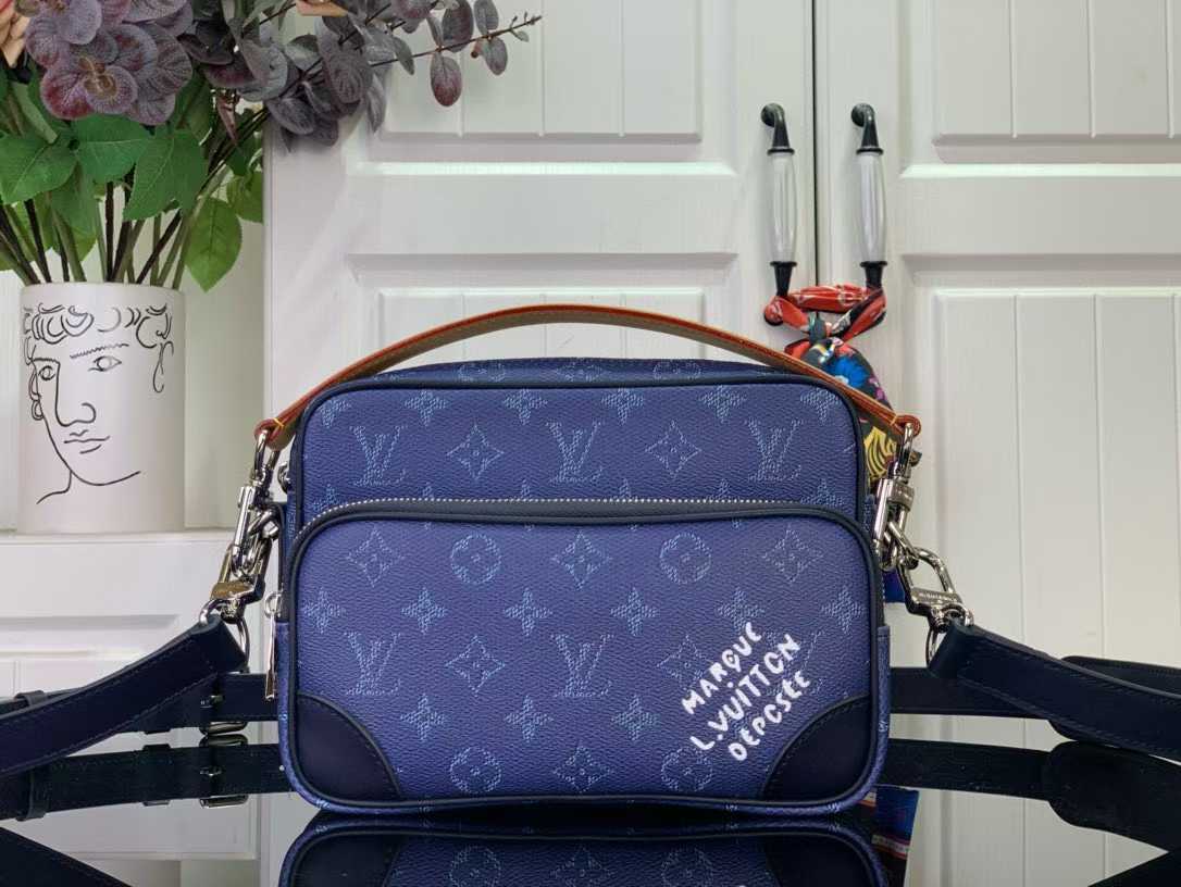 LV Chanel Kelly mini bag with a top handle, likely in aged calfskin leather