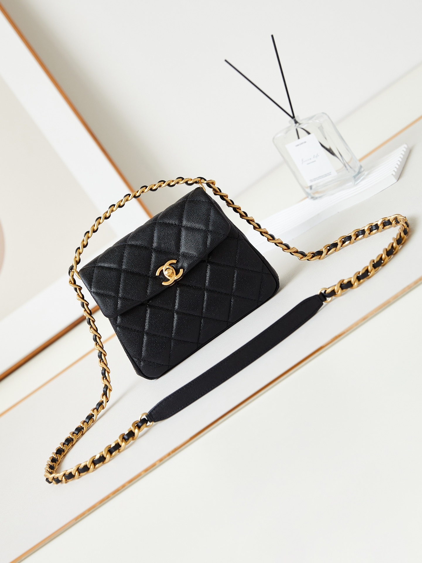 Chanel small quilted crossbody bag in black lambskin leather
