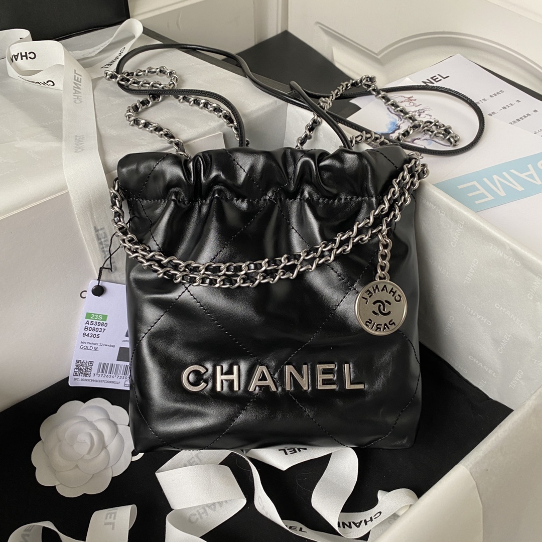 Chanel 22 Mini hobo handbag in black shiny calfskin leather