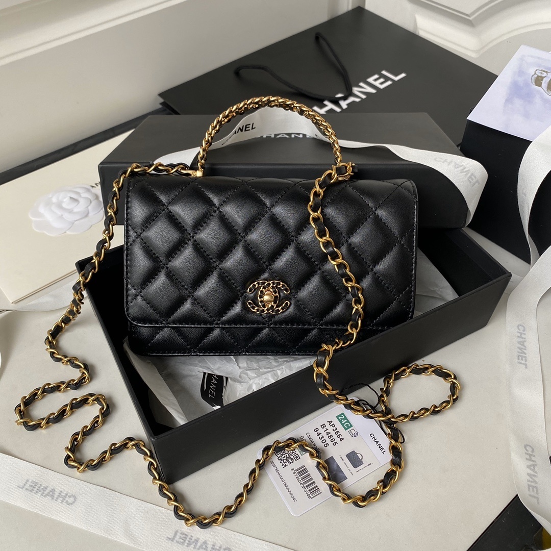 Chanel Wallet On Chain (WOC) bag in quilted black lambskin or calfskin leather