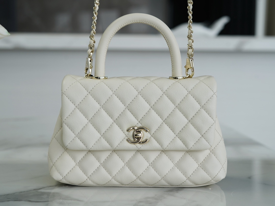 Chanel Mini Coco Handle Flap bag in white caviar leather