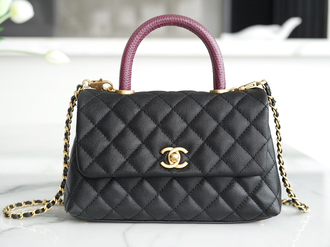 Chanel Coco Handle bag in black caviar leather with a burgundy lizard top handle