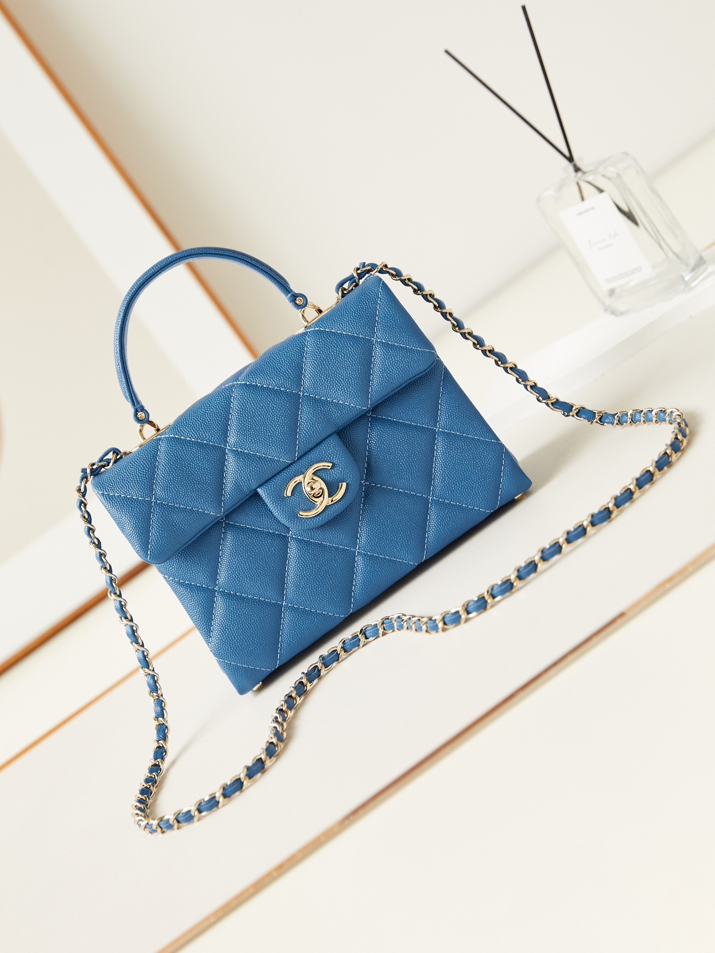 Chanel Mini Flap Bag with Top Handle in blue caviar leather