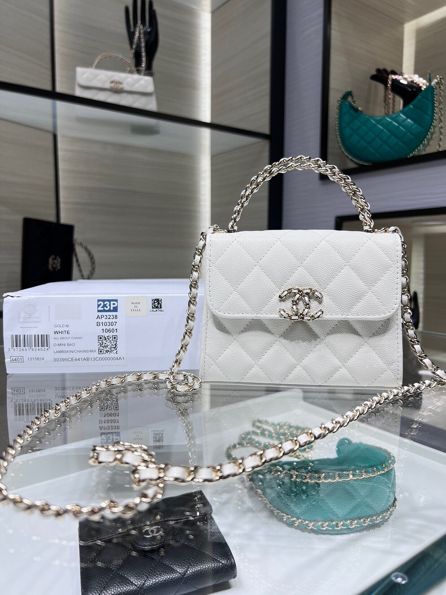 Chanel 23P Top Handle Clutch with Chain in white caviar leather and light gold hardware