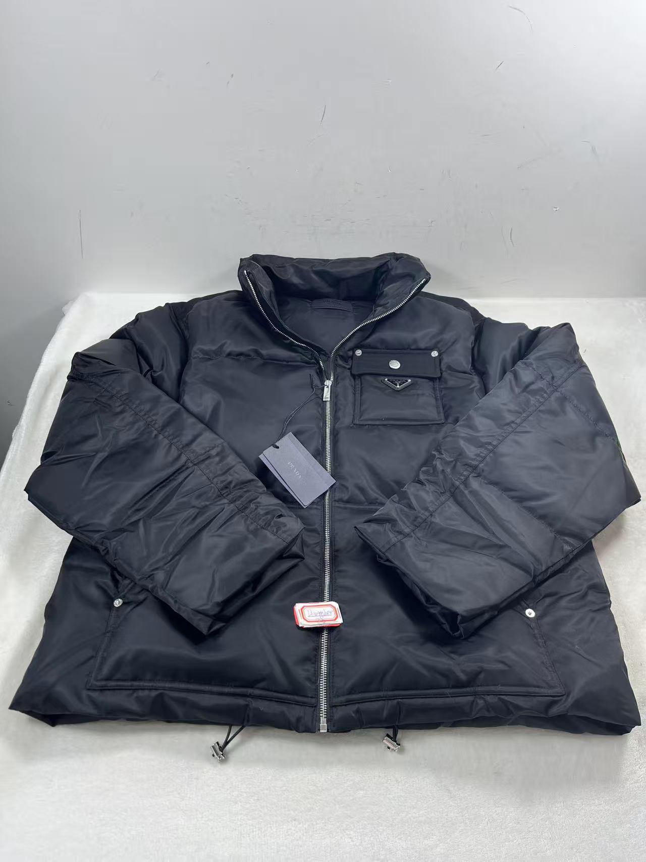 Prada Re-Nylon puffer jacket in black size chest 130cm