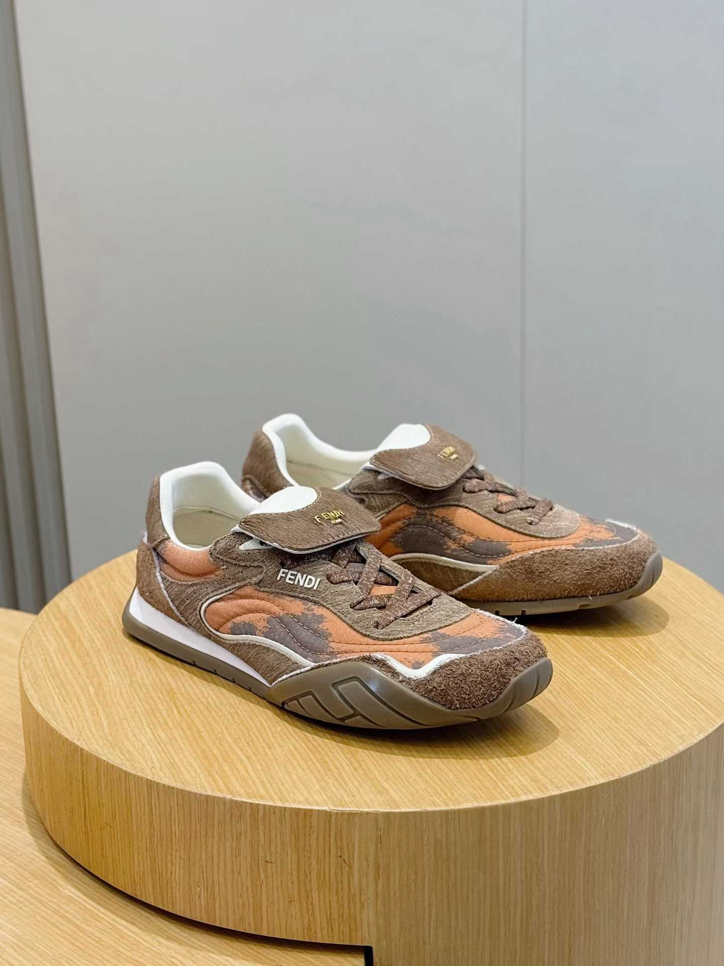 Fendi Wave Pulse mixed-media low-top sneakers in brown and orange