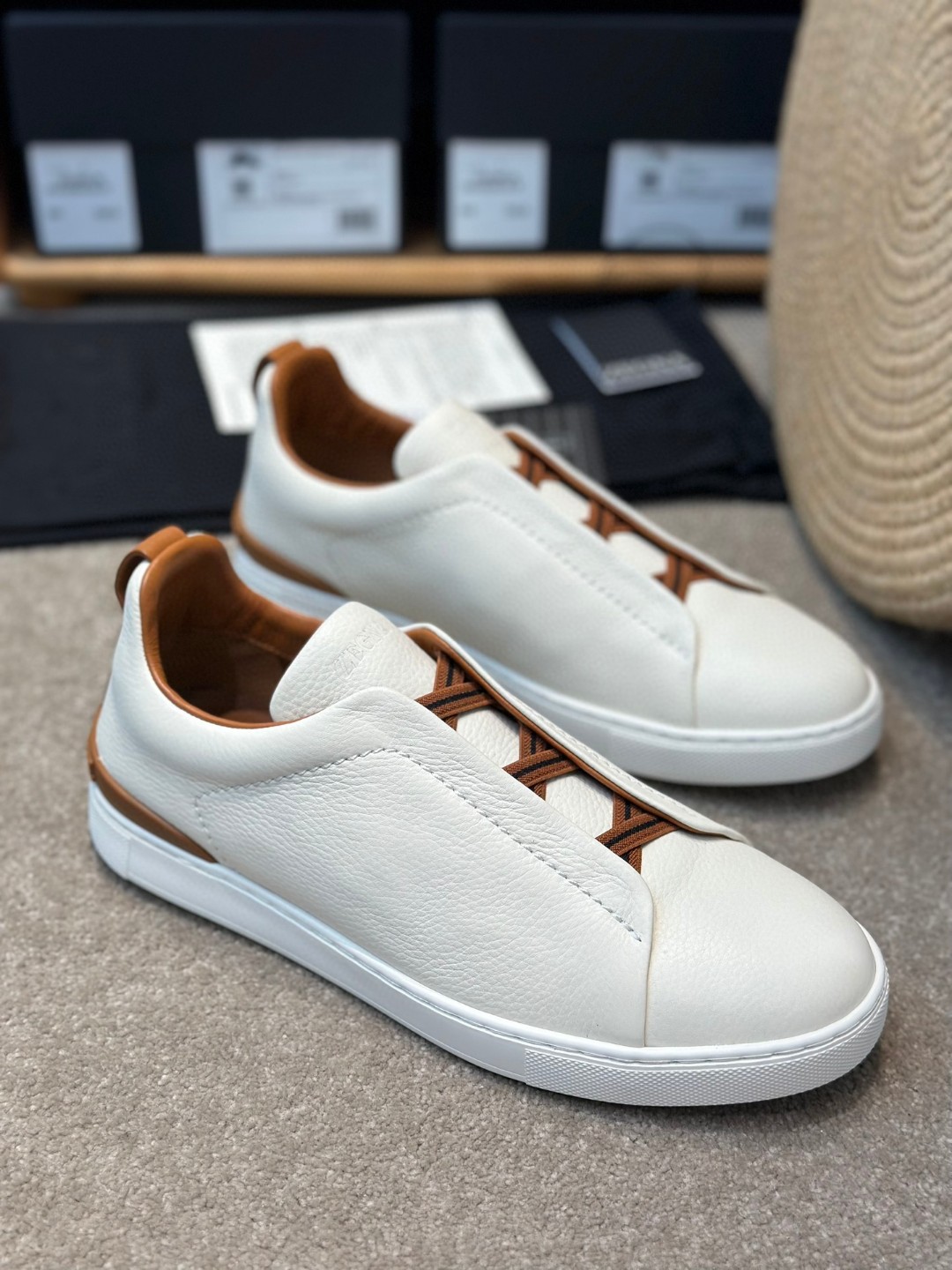Zegna Triple Stitch sneaker in off-white deerskin leather with brown accents