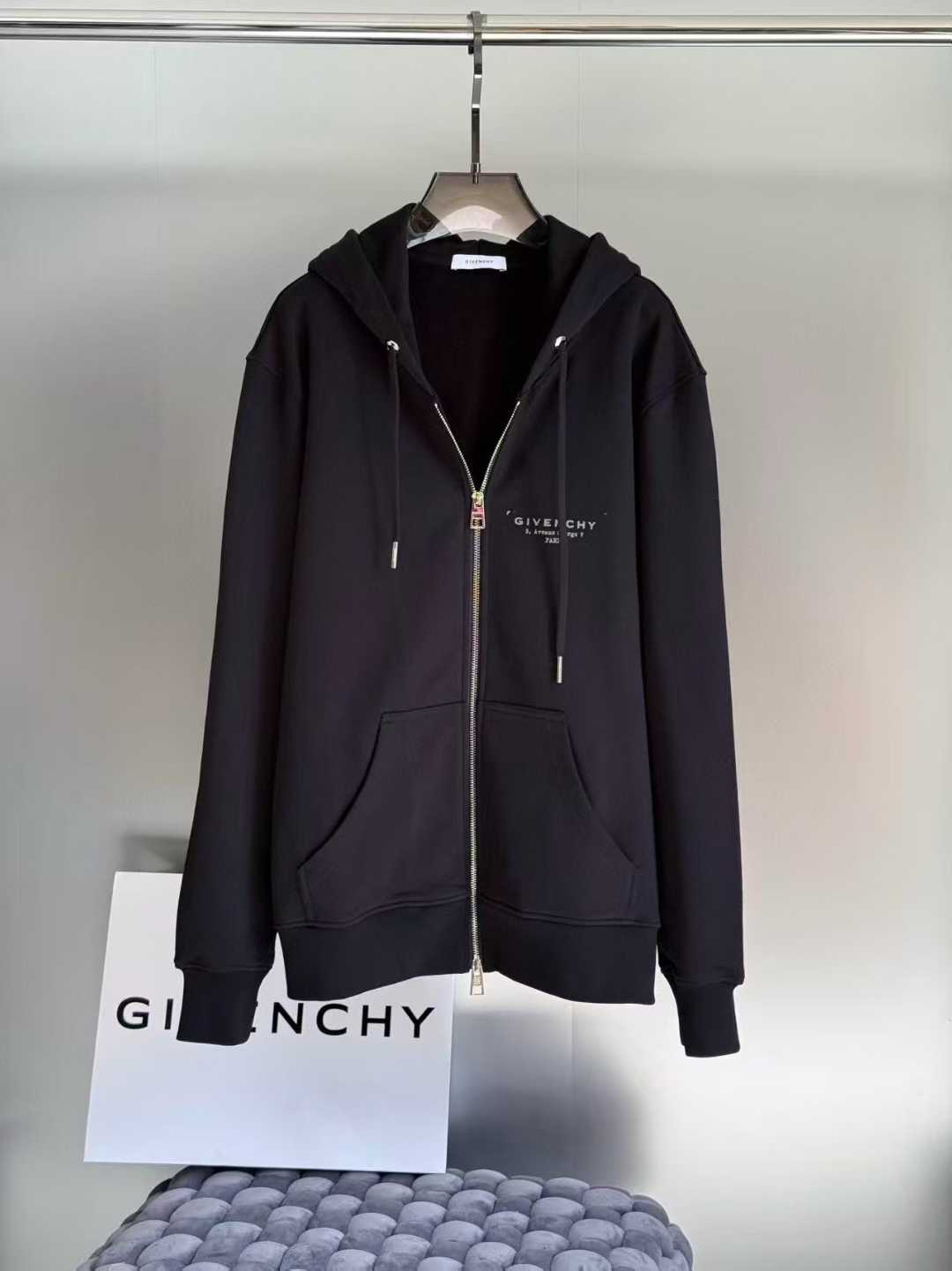 Givenchy zip-up hoodie in black with a small logo on the chest