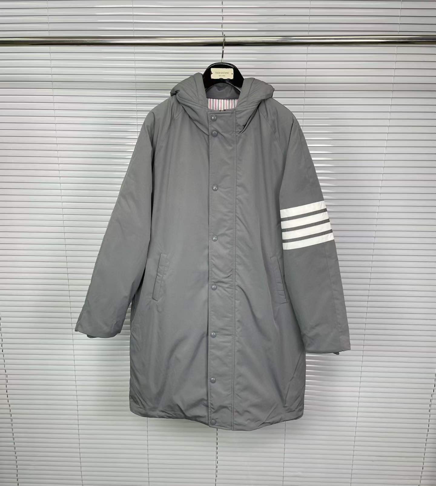 Thom Browne grey down-filled hooded parka coat with the signature 4-Bar stripe on the sleeve