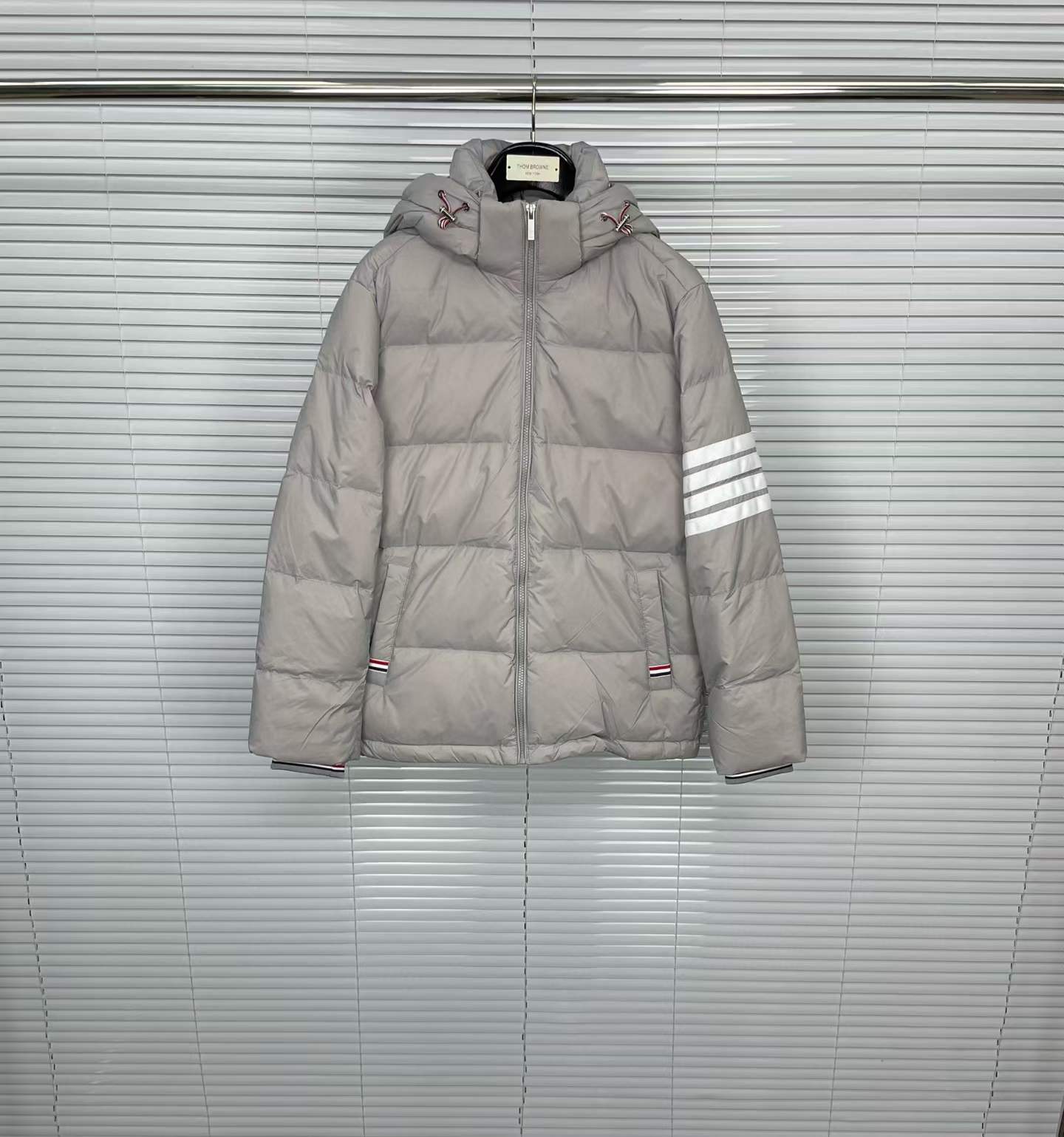 Thom Browne grey down-filled puffer jacket with a signature 4-Bar stripe on the sleeve