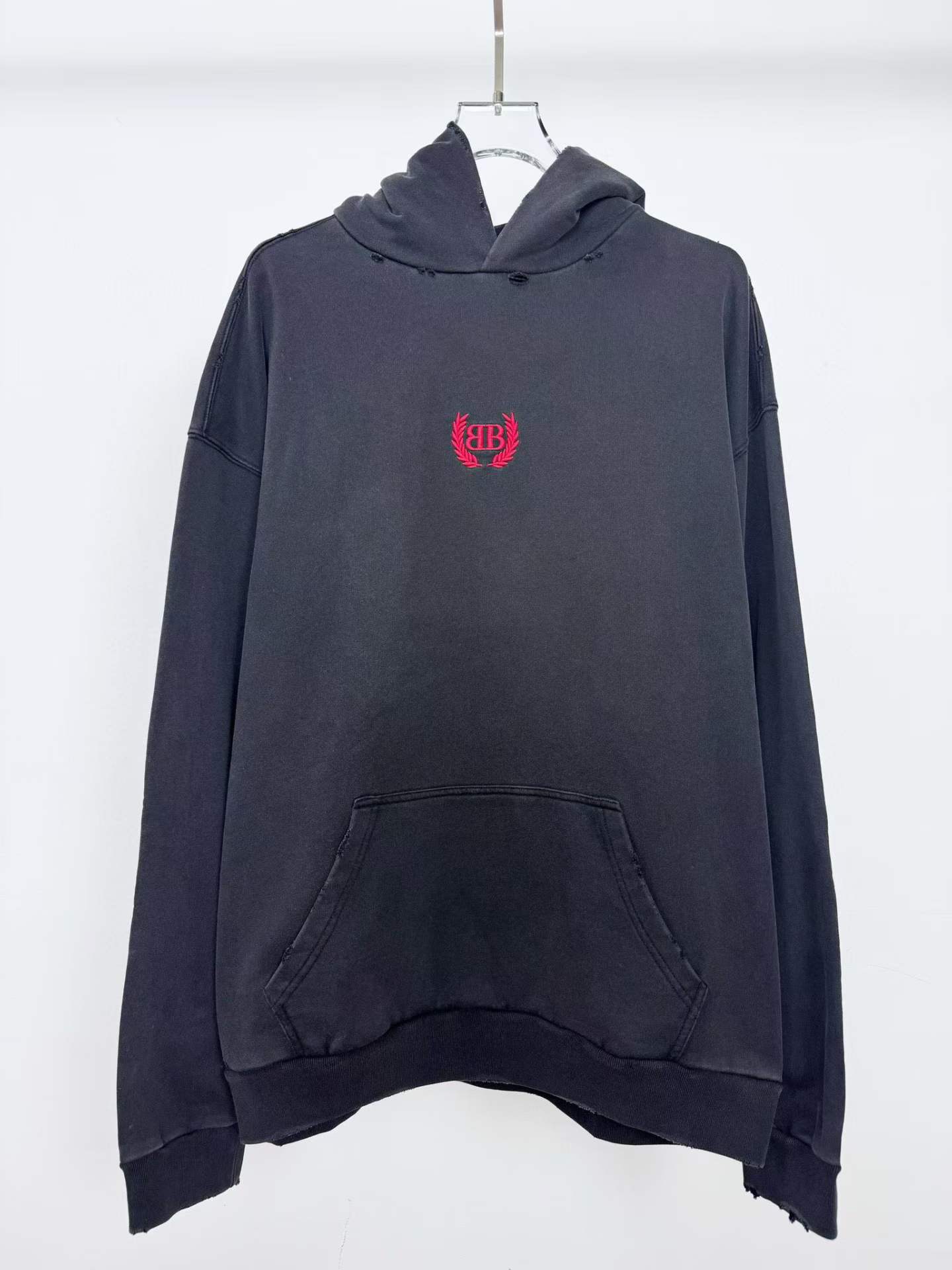 Balenciaga Black Relaxed Fit Hoodie with a red embroidered logo