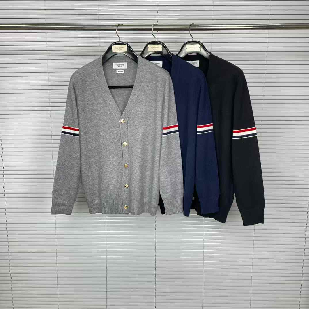 Thom Browne RWB stripe V-neck cardigan in grey, navy blue, and black virgin wool or cotton.