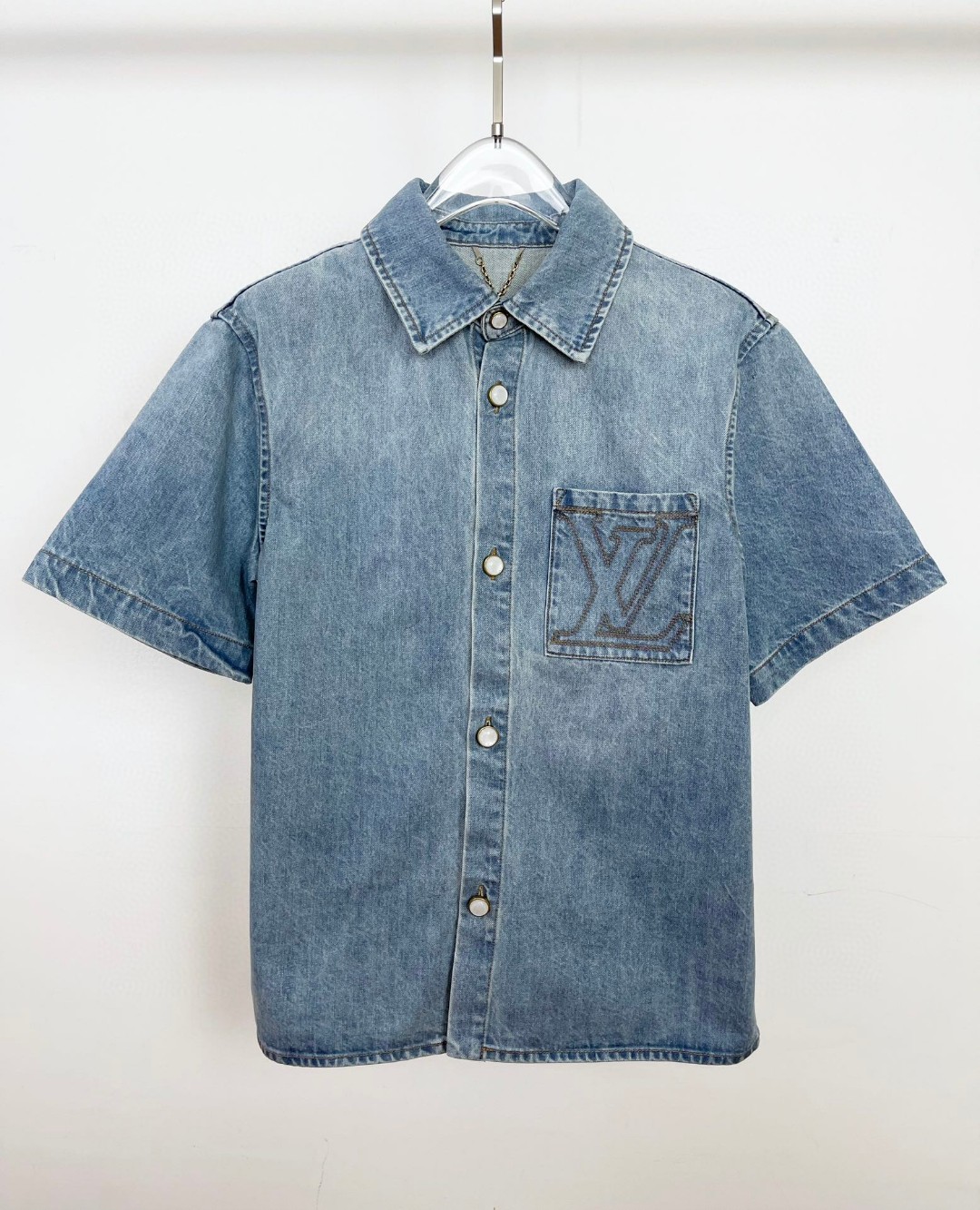 LV short-sleeved denim shirt in stone-bleached Japanese denim with an embroidered LV signature on the chest pocket