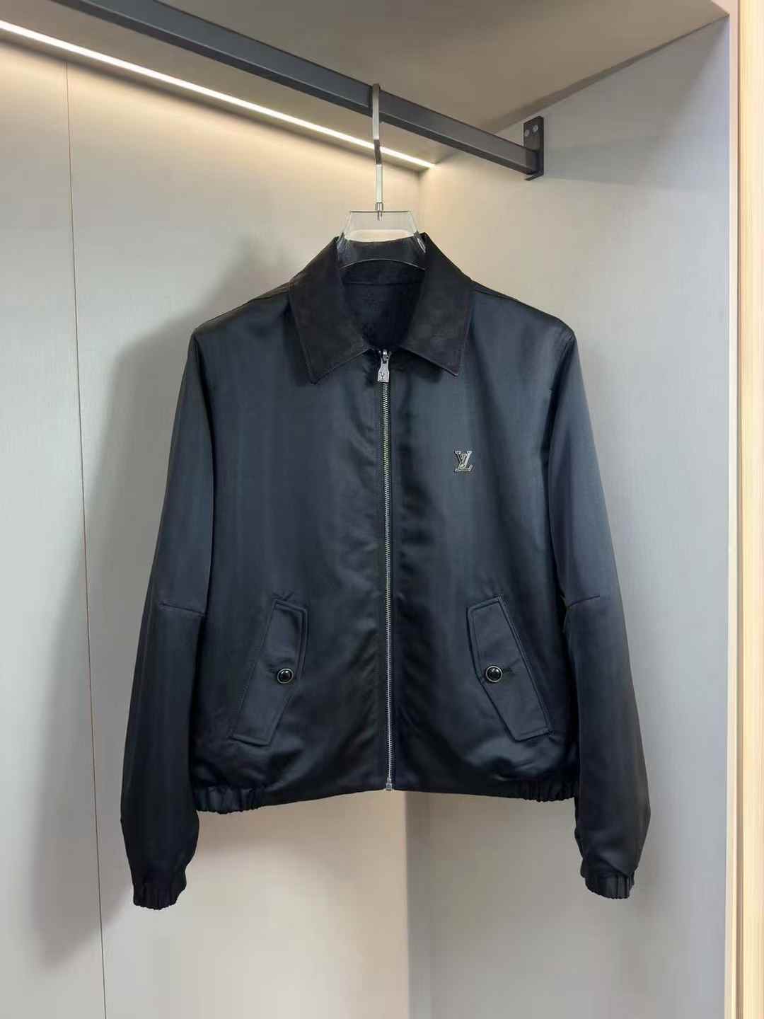LV Monogram Chic Reversible Blouson in black satin with a Damier leather collar and metal LV ornament on the chest