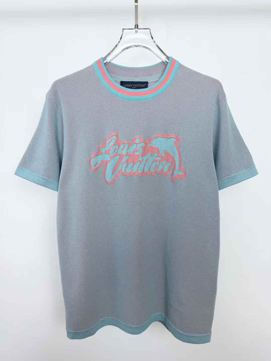 LV Graphic Short-Sleeved Crewneck T-shirt in a textured waffle knit with a coral pink and aqua blue LV Dolphins intarsia signature