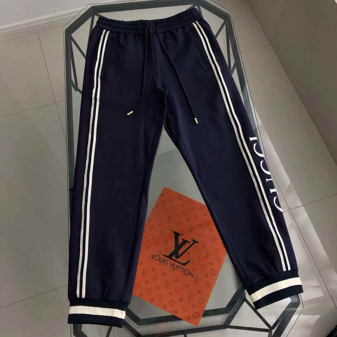 Gucci technical jersey jogging pants in midnight blue with side stripe detailing.