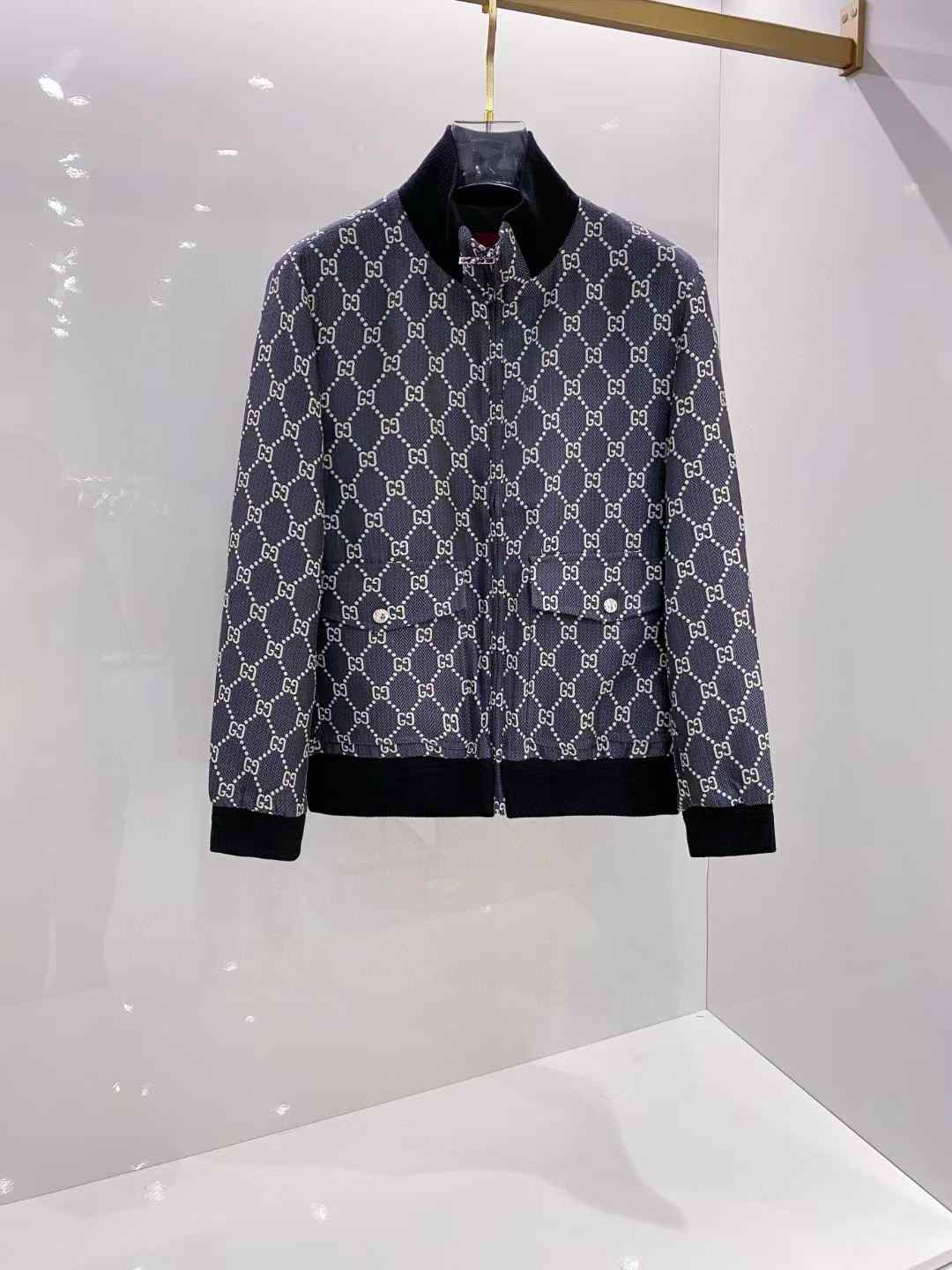 Gucci bomber jacket with a monogram print.
