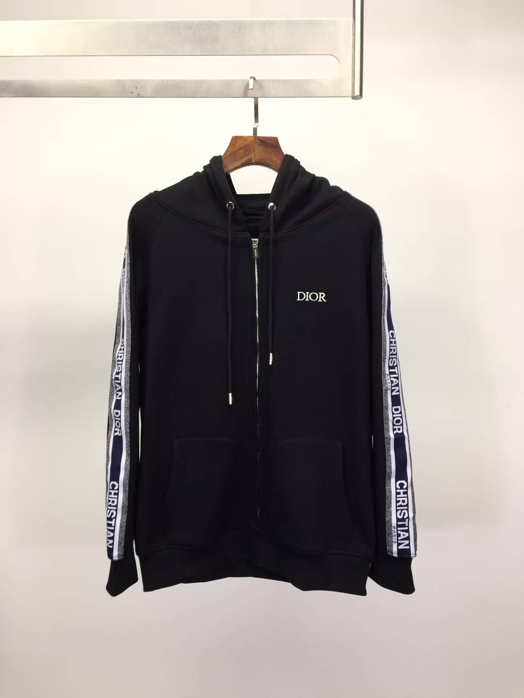 Dior zip-through hoodie with "Christian Dior" logo taping down the sleeves