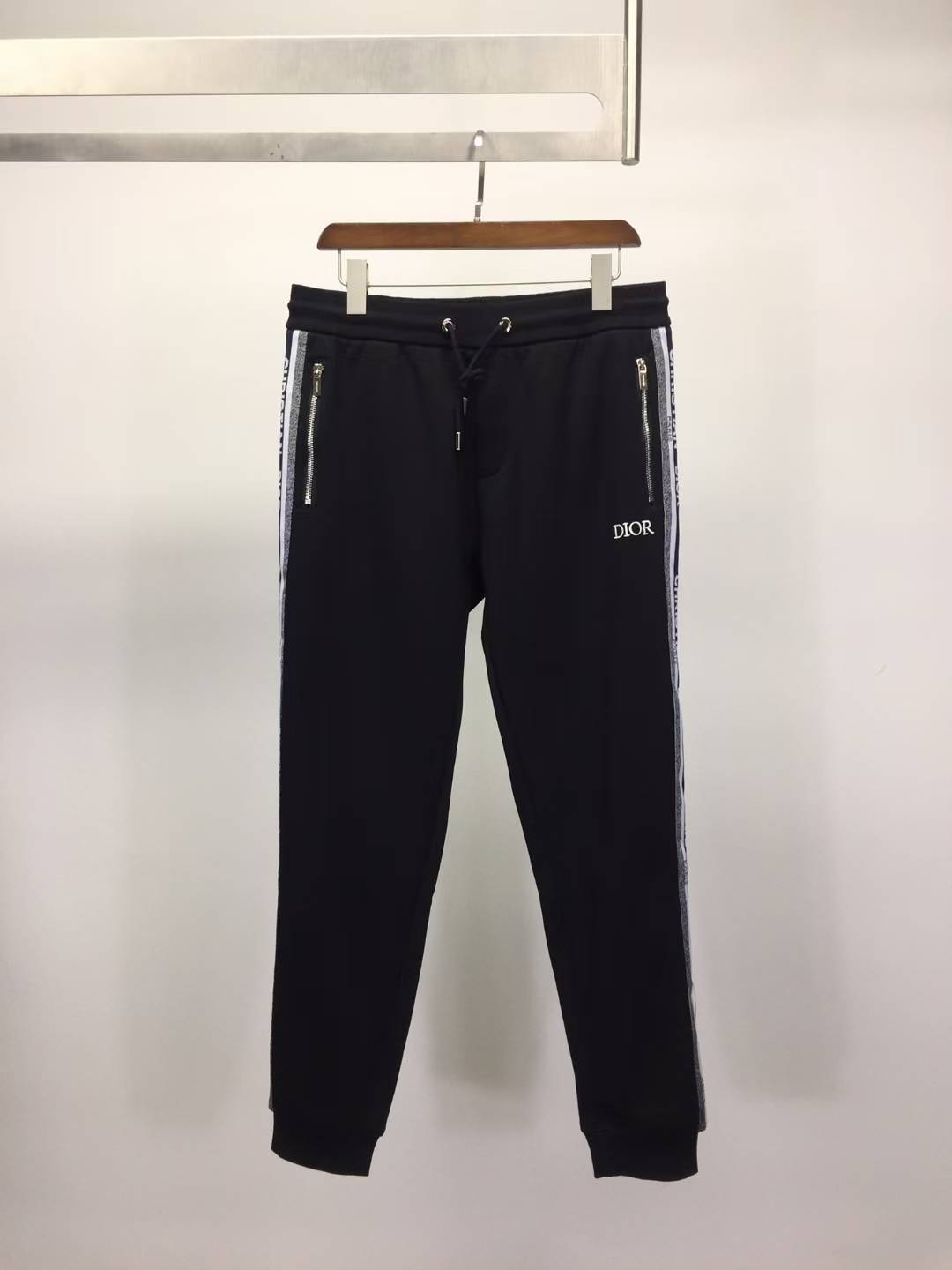 christian dior black tracksuit bottoms with side stripes and zip pockets