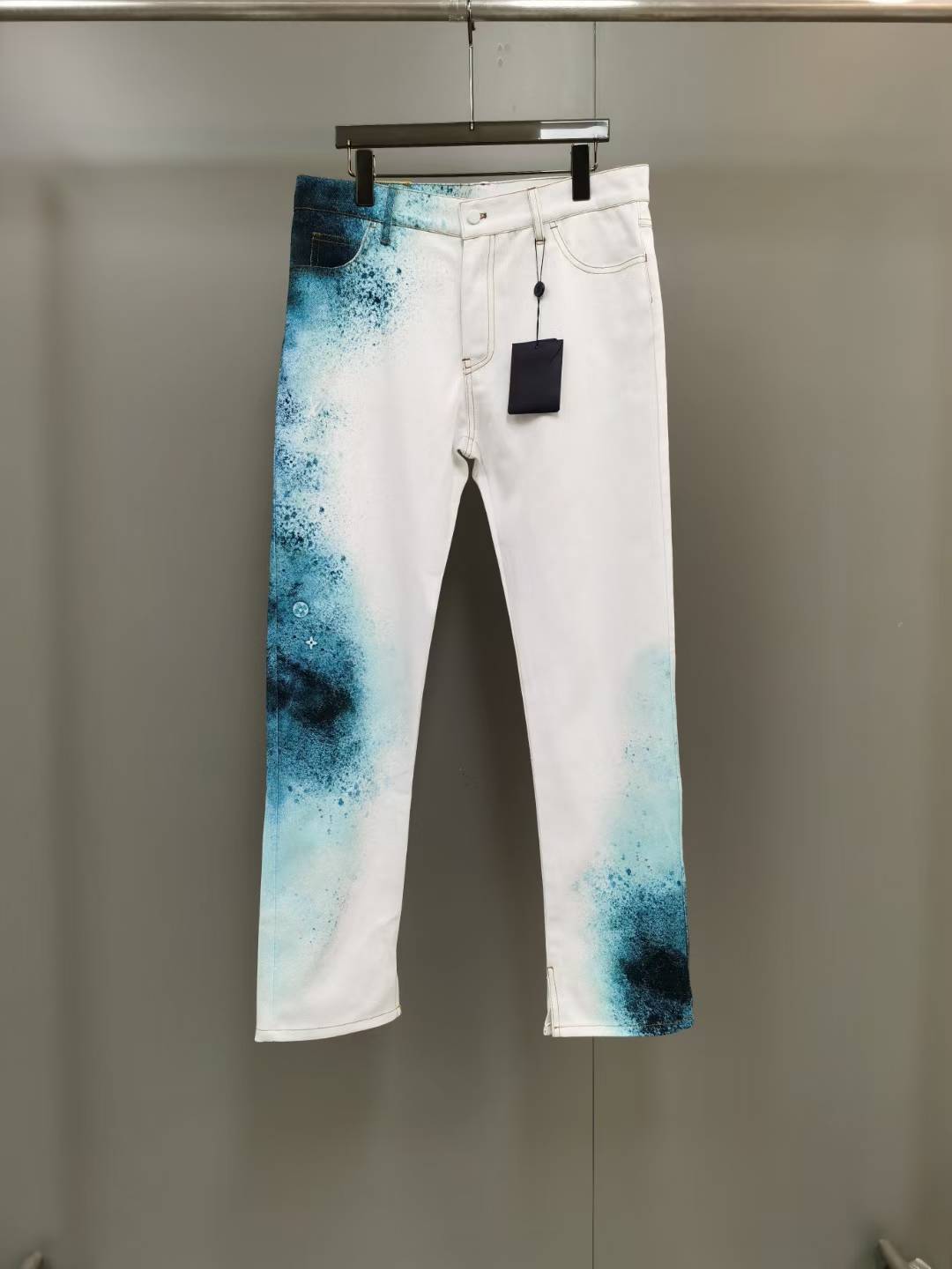 LV Spray Denim Trousers in white with a blue ink dye design