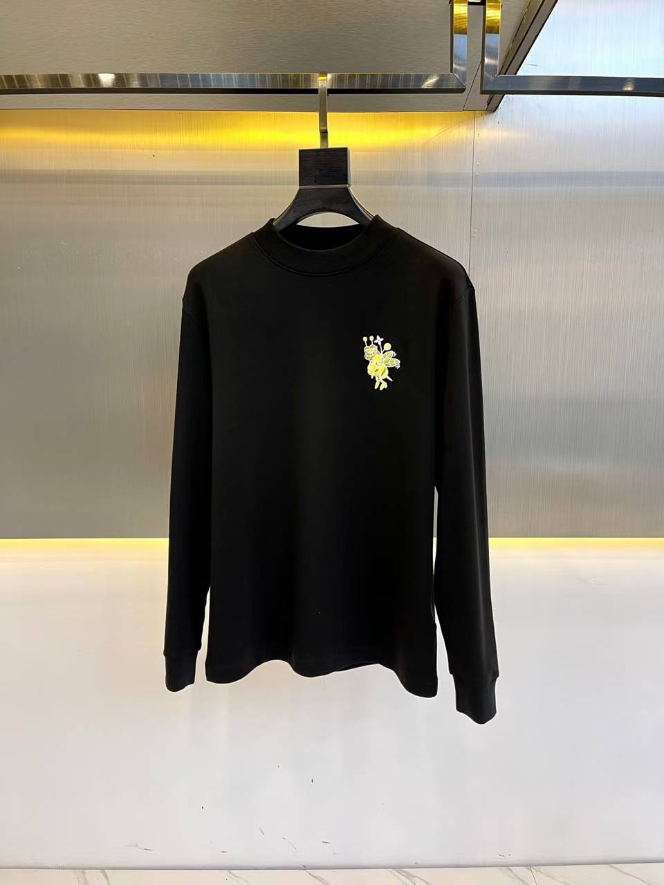 Off-White Flower Arrow organic-cotton sweatshirt in black with a light yellow/multicolor graphic print on the chest