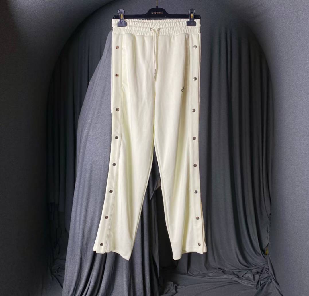 Celine Snap Track Pants in a cream or white