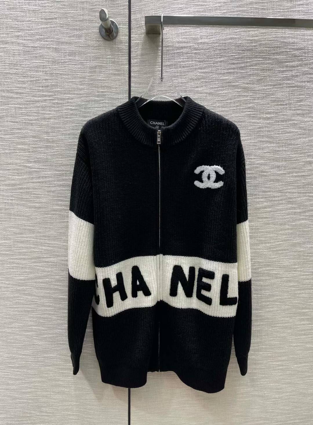 Chanel black and white blocked zip cardigan with jacquard logo and lettering