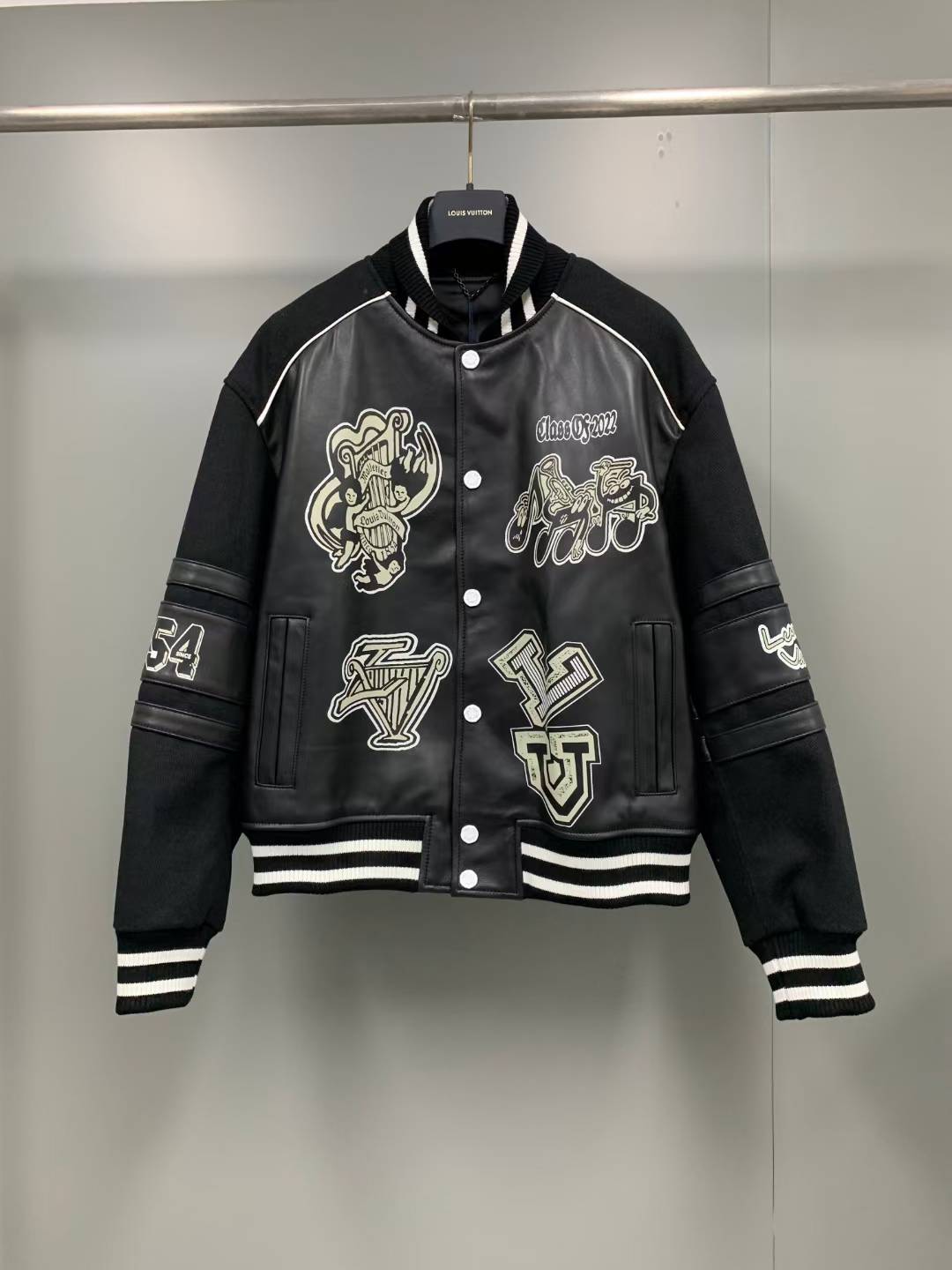LV Varsity Blouson jacket with leather panels and various appliques