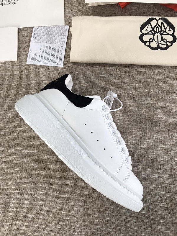 Alexander McQueen Oversized Sneaker with a white leather upper and a black heel tab