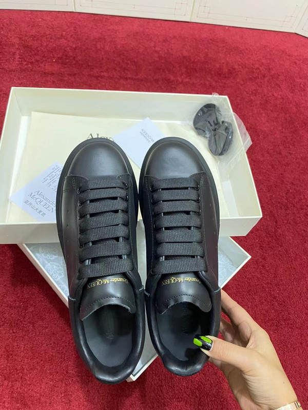 Alexander McQueen black calf leather Oversized low-top sneaker