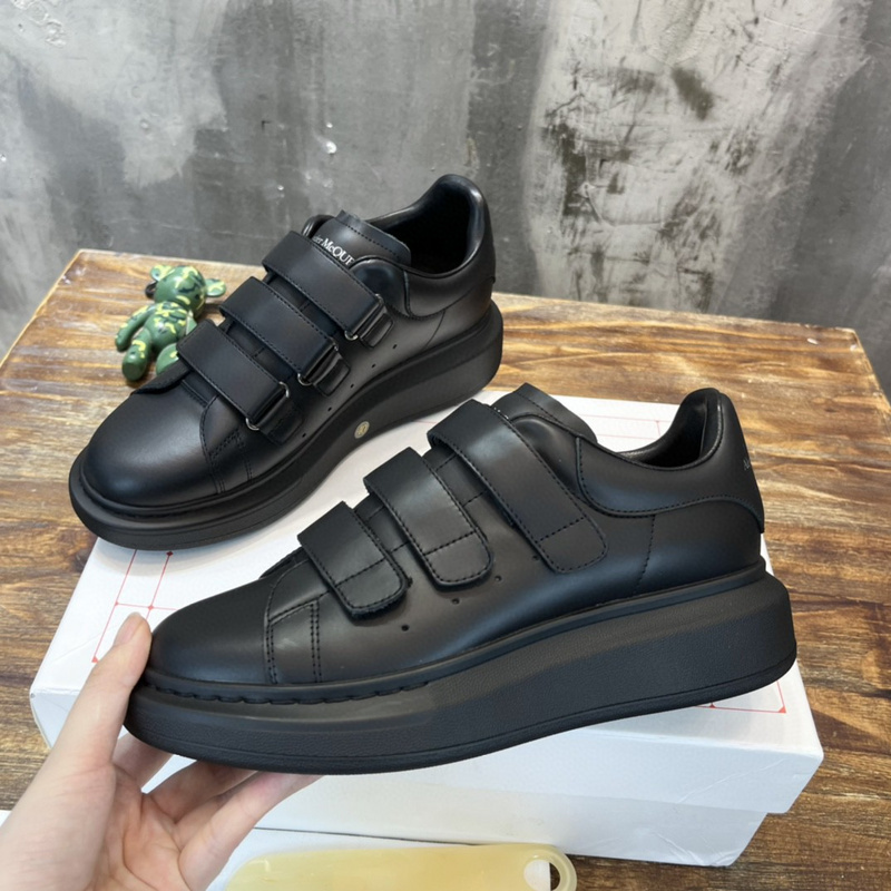 Alexander McQueen Larry Sneaker in black leather with a chunky rubber sole and triple-strap hook-and-loop closure