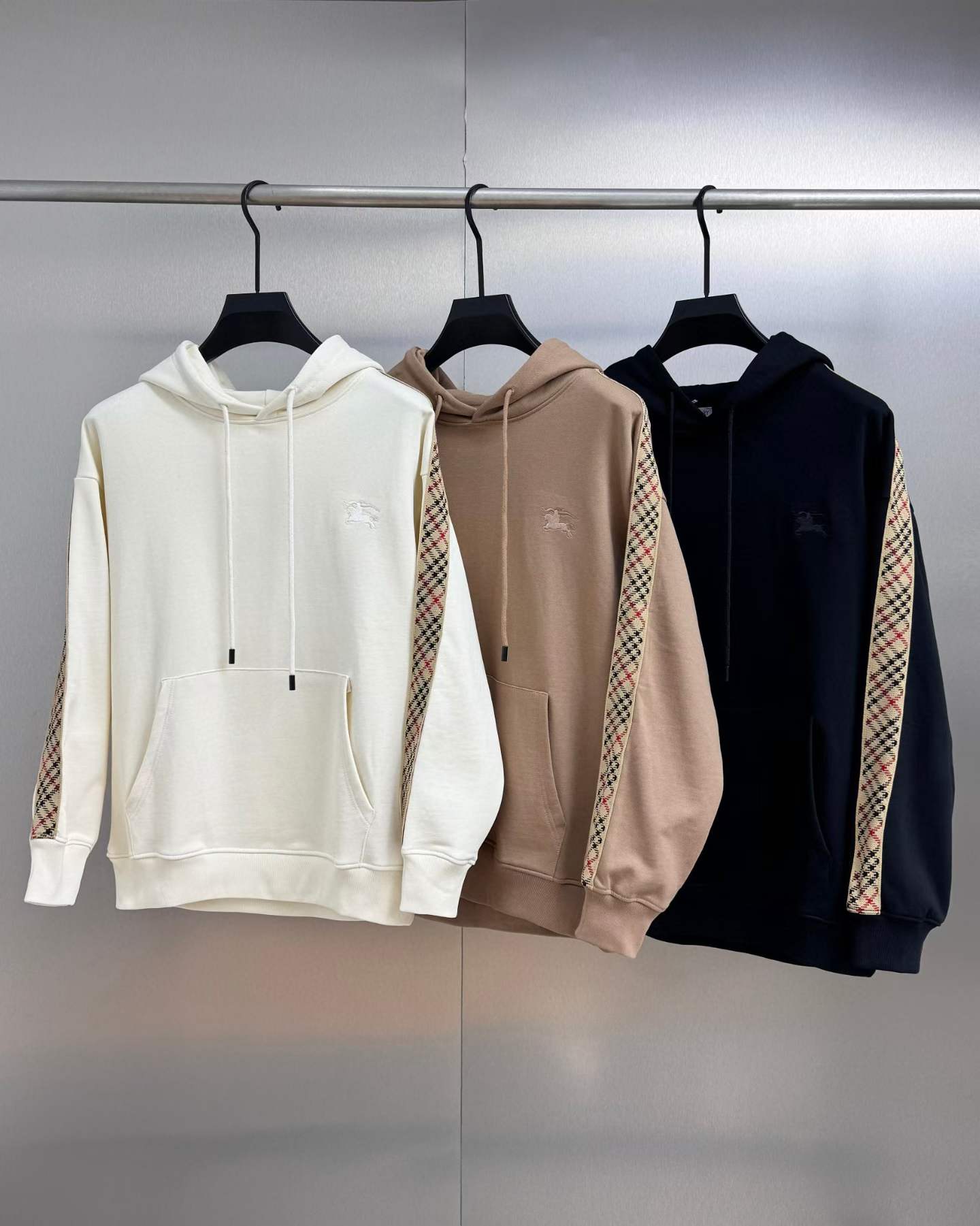 Burberry Check-Trim cotton hoodies in white, beige/clove brown, and black