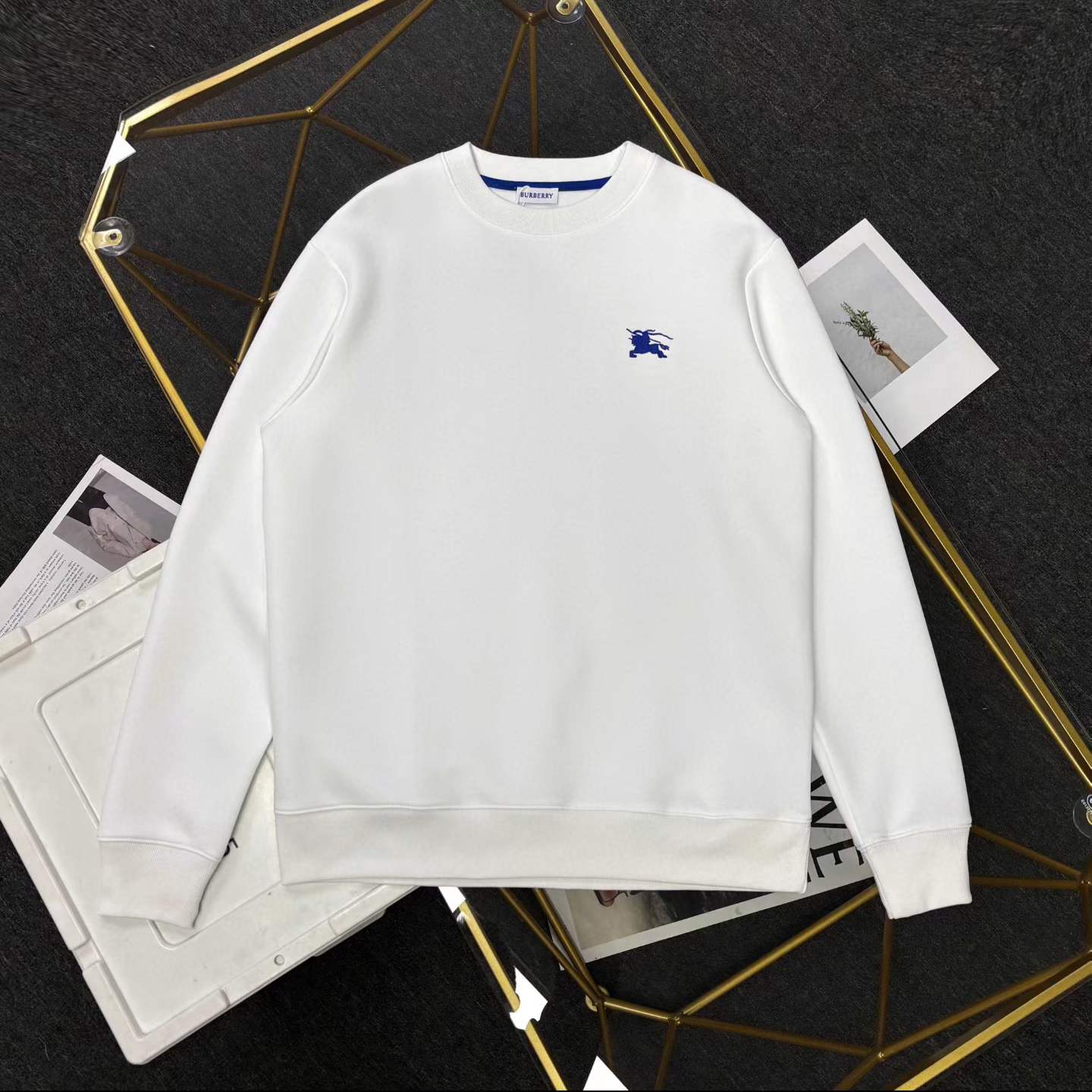 Burberry men's long-sleeve sweatshirt with a blue embroidered logo.
