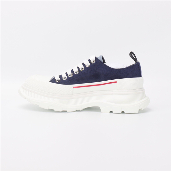 Alexander McQueen Tread Slick low-top sneaker featuring a chunky rubber sole.